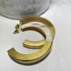 boucles d'oreilles dorée en corne de buffle
